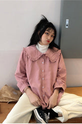 Blusa lisa con cuello Peter Pan